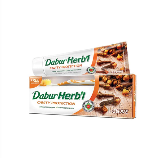 Dabur Herbal Cavity Protection Clove Toothpaste (140g) with Toothbrush | Enriched with Clove | Natural Toothpaste For Cavity Free Strong Teeth