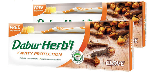 Dabur Herbal Cavity Protect Clove Toothpaste, 140 gm + Toothbrush (Pack Of 2)